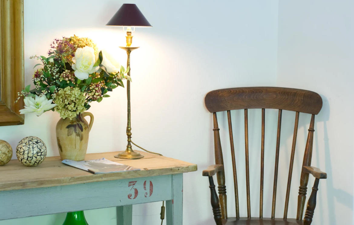 Fresh flowers on a writing table in a softly lit room